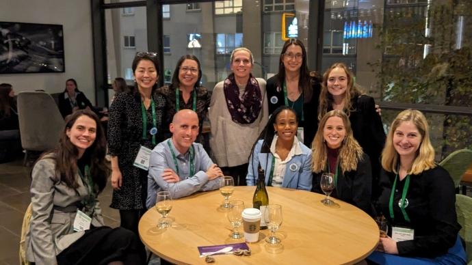 Carolyn Becker poses for a photo with some colleagues and former students