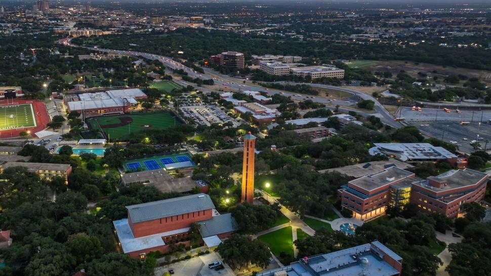 a drone shot of Trinity's campus at night