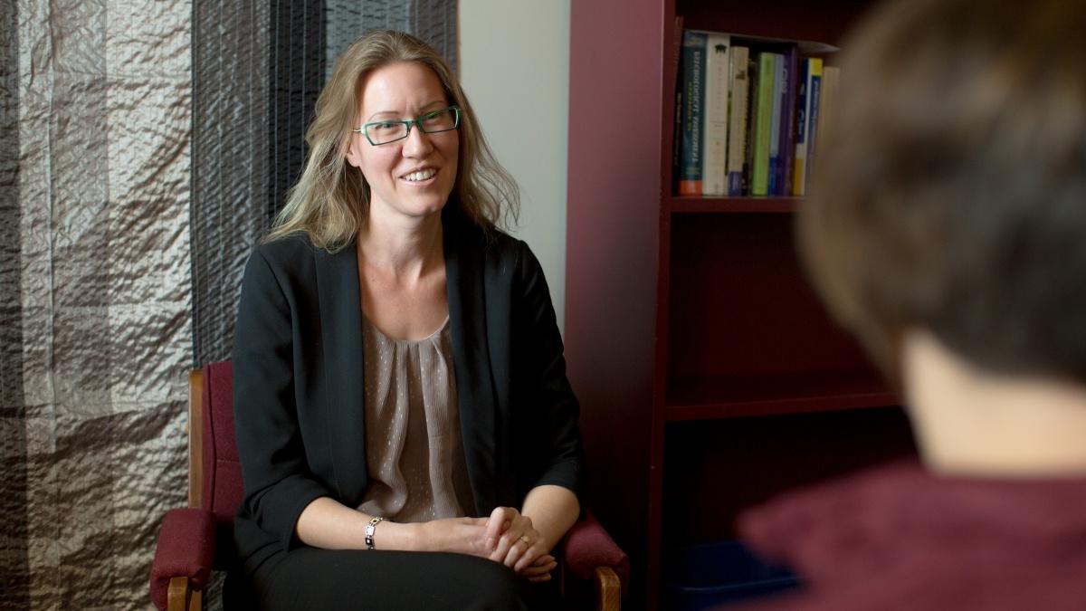 Professor talking to student while both are seated